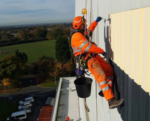 Rappel IRATA Industrial Rope Access Abseiling and MEWP - Signage Removal and Cladding Painting Project