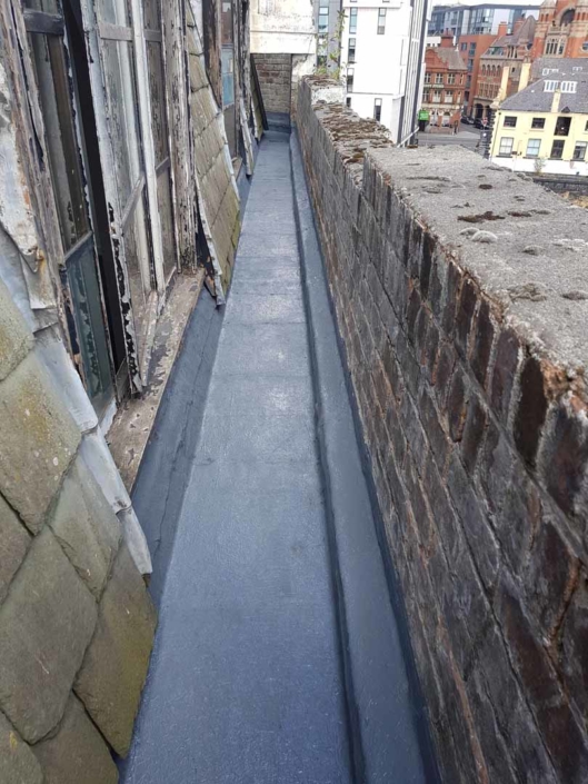 Sika Gutter Waterproofing and Lining Works, Liverpool. High Level Building Maintenance Services & Rope Access Contractors.