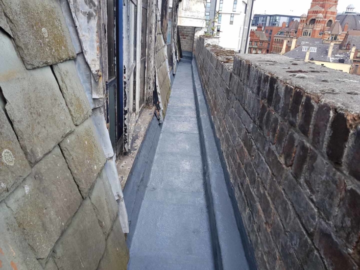 Sika Gutter Waterproofing and Lining Works, Liverpool. High Level Building Maintenance Services & Rope Access Contractors.