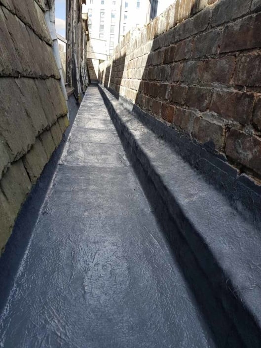 Sika Gutter Waterproofing and Lining Works, Liverpool. High Level Building Maintenance Services & Rope Access Contractors.