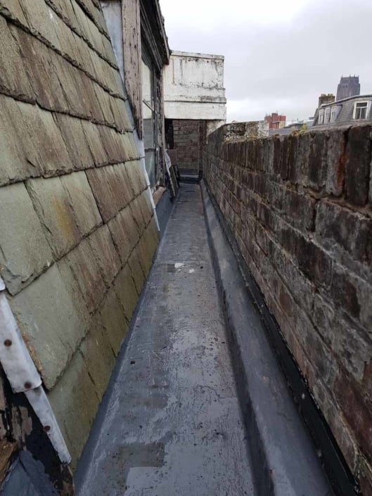 Sika Gutter Waterproofing and Lining Works, Liverpool. High Level Building Maintenance Services & Rope Access Contractors.