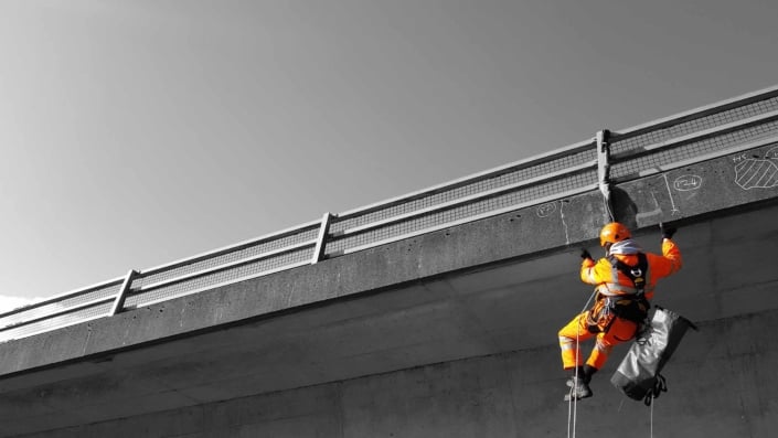 Rappel rope access technician undertaking a principal bridge inspection