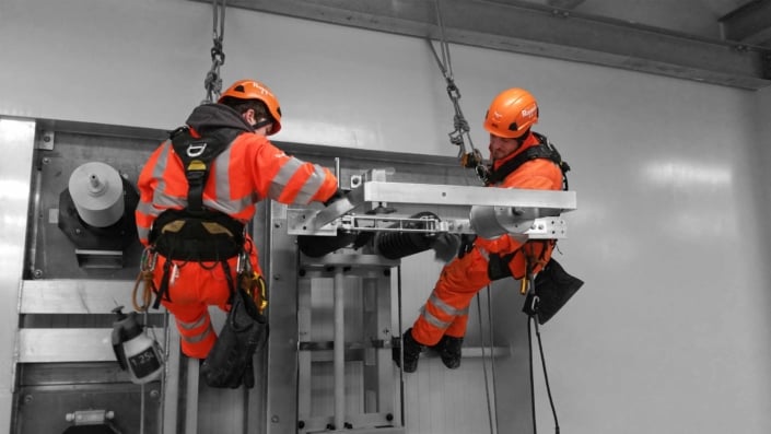 Rappel rope access technicians undertaking high level industrial cleaning works