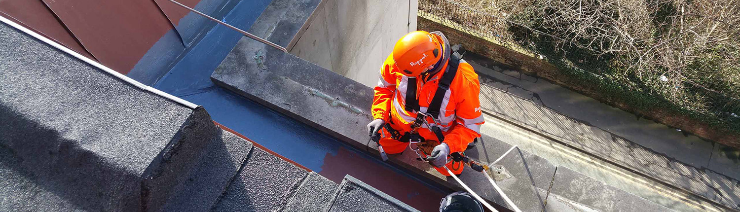 Rope Access technician repairing a mansard gutter with lining system