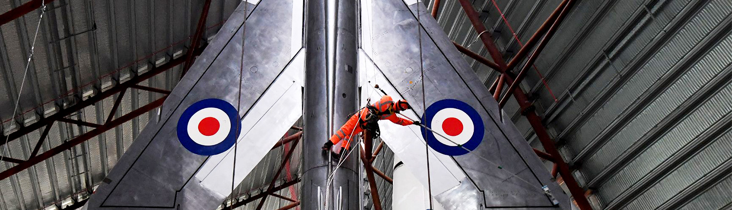 Rappel Rope Access team cleaning jet fighter plane at RAF Cosford Museum