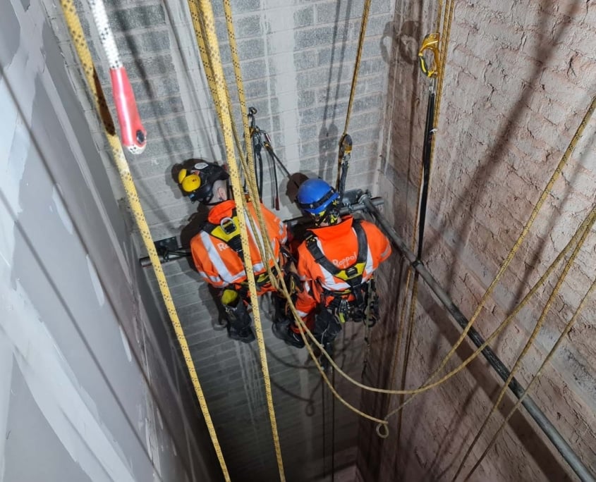 Our Rope Access team is installing a temporary decking system in a lift shaft